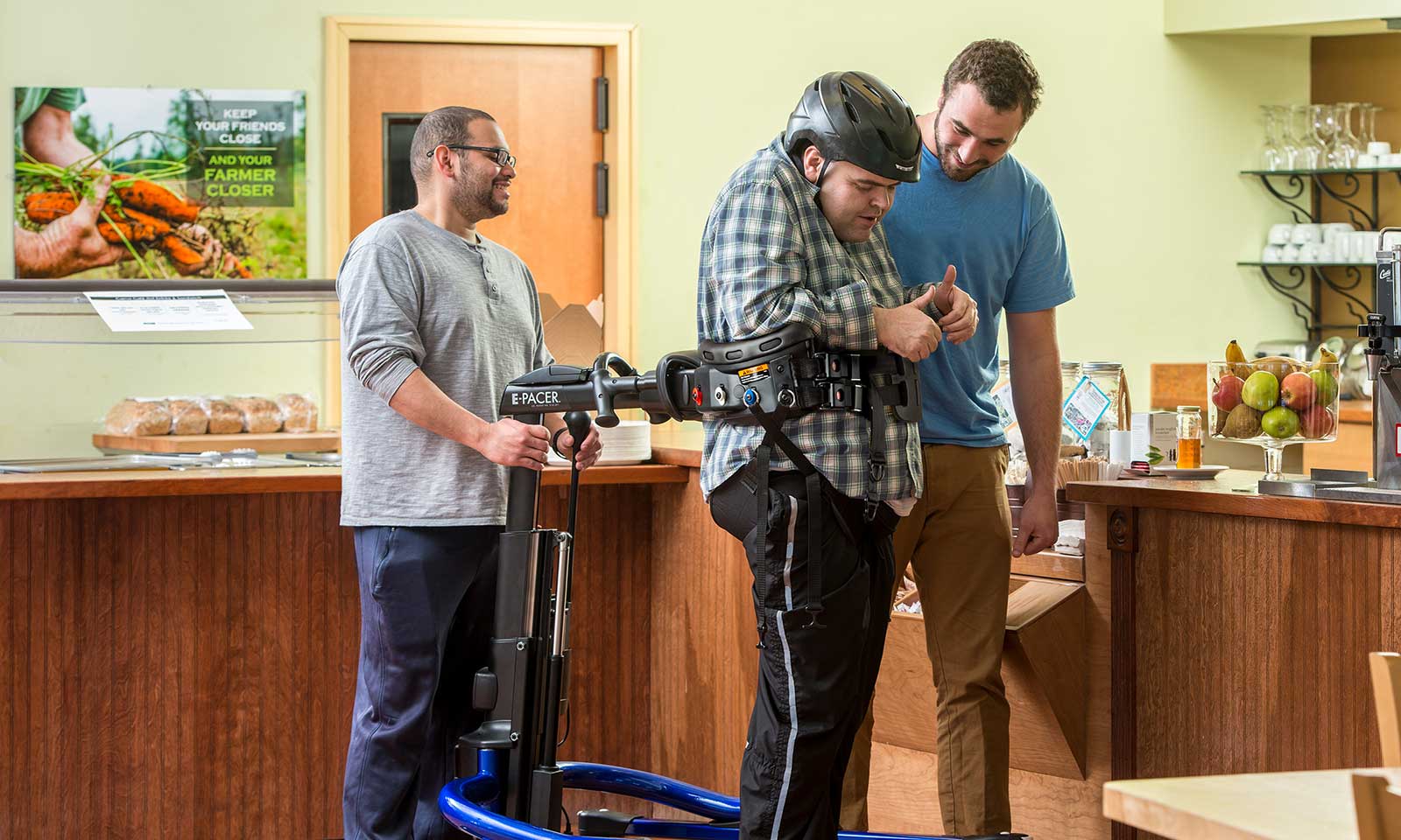 Young man using E-Pacer Gait Trainer by Rifton