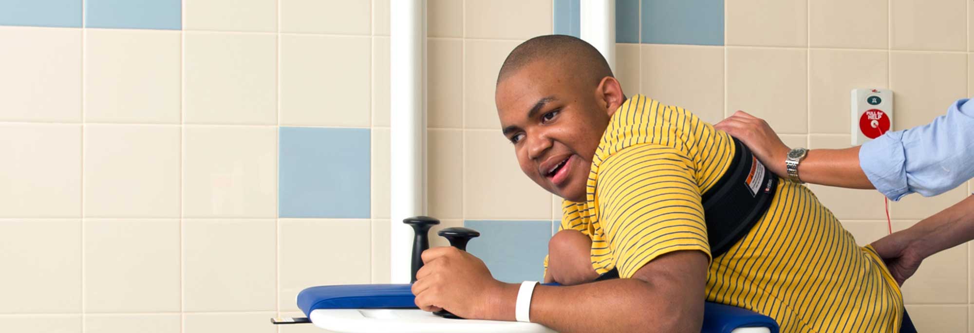 young man using a support station