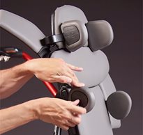 Hands shown adjusting the laterals on the Rifton Size 1 Stander